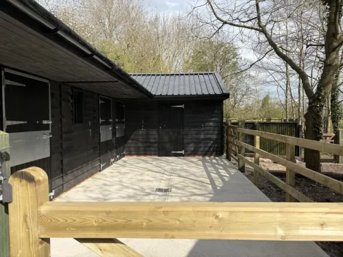 Completed black timber stables